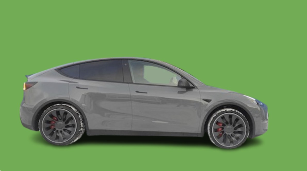Tesla Model Y — PO montażu (widok z tyłu) Tesla Model Y po montażu podkładek dystansowych 20 mm — tył